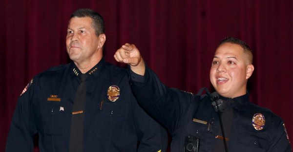 Lemoore Police Chief Darrell Smith honors Lemoore Police Officer Eric Trevino during Friday's Lemoore Chamber of Commerce sponsored Kings County Public Safety Appreciation Luncheon.